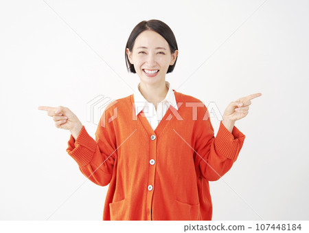 Female pointing on both sides white background 107448184