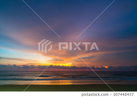 amazing pink sky above Karon beach Phuket at colorful sunset. sweet sky in colorful sunset above the ocean. Imagine a fantasy bright pink in blue sky at sunset. Sky texture background. 107448437