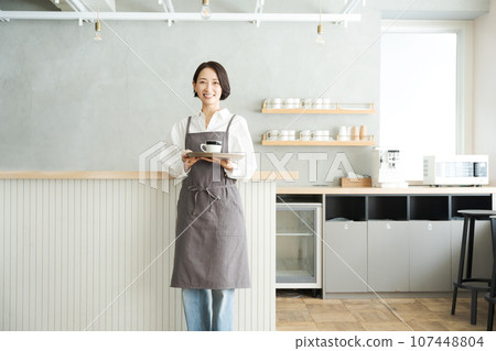 cafe clerk with coffee cafe clerk with coffee 107448804
