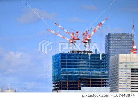 High-rise buildings and construction cranes 107448974