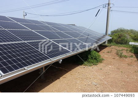 A solar power plant where the ground has subsided and the pedestal has become distorted A solar power plant where the ground has subsided and the pedestal has become distorted 107449093