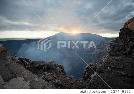 Rocky volcanic crater  with gas 107449132