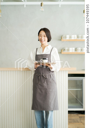 Cafe clerk with coffee cup 107449395