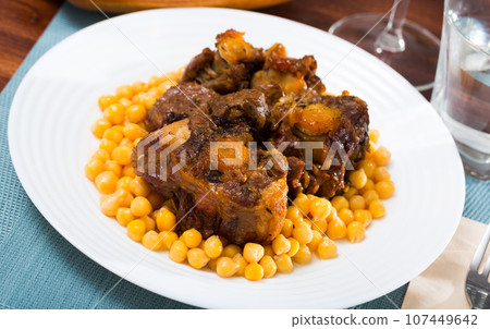 Oxtail stew with chickpeas - traditional Spanish dish Oxtail stew with chickpeas - traditional Spanish dish 107449642