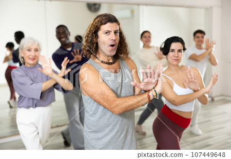 Group of people practicing energetic lindy hop movements 107449648