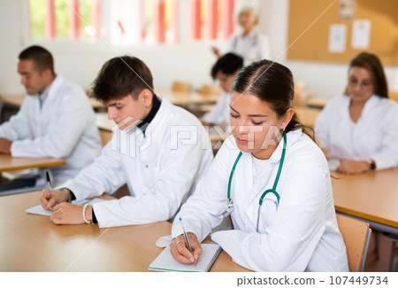 Young woman medical student attending lecture in university 107449734