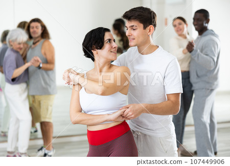 Dancing positive couples learning salsa 107449906