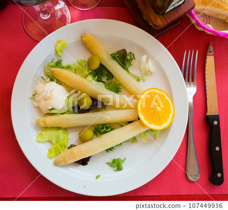 Baked white asparagus with greens Baked white asparagus with greens 107449936