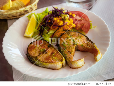 Fried salmon steaks Fried salmon steaks 107450146