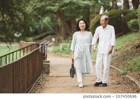 Senior couple walking and traveling Senior couple walking and traveling 107450696