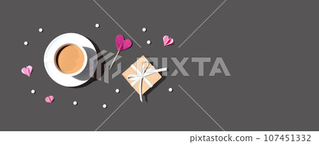 A cup of coffee with a gift box and hearts A cup of coffee with a gift box and hearts 107451332