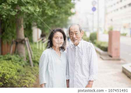 Senior couple going for a walk and shopping 107451491