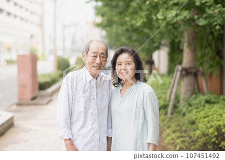 Senior couple going for a walk and shopping 107451492