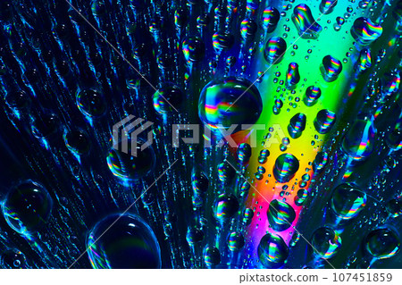 Upward flowing fizzy bubbles with a ray of rainbow colored burst in abstract background asset Upward flowing fizzy bubbles with a ray of rainbow colored burst in abstract background asset 107451859