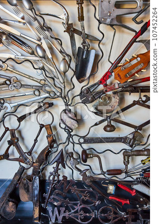 Wall of interconnecting tools connected by wires on white background 107452264