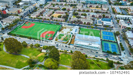 Aerial apartment buildings with multiple sport fields and courts in San Francisco Aerial apartment buildings with multiple sport fields and courts in San Francisco 107452491