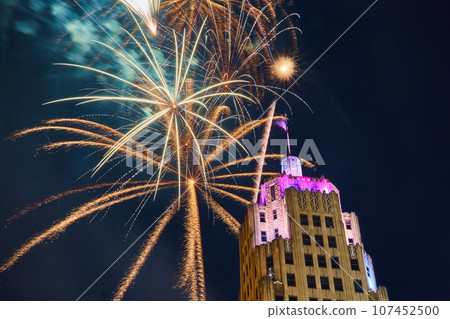 Gold fireworks behind Lincoln Tower downtown Fort Wayne on 4th of July with purple lights Gold fireworks behind Lincoln Tower downtown Fort Wayne on 4th of July with purple lights 107452500
