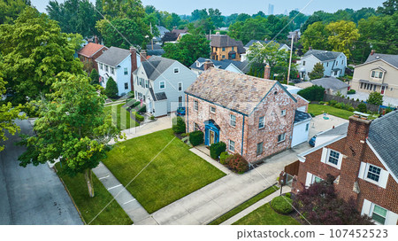 Aerial of houses off Pemberton Dr with distant Fort Wayne downtown skyscrapers 107452523