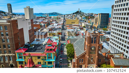Chinatown from drone aerial with distant San Francisco Bay and Coit Tower Chinatown from drone aerial with distant San Francisco Bay and Coit Tower 107452524