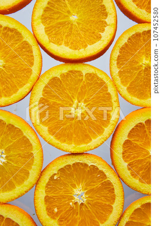 Close up of orange slices on white background 107452580
