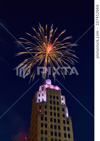 Downtown Fort Wayne Lincoln Tower with purple lights and golden 4th of July fireworks overhead Downtown Fort Wayne Lincoln Tower with purple lights and golden 4th of July fireworks overhead 107452668