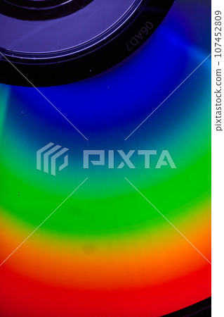 Curved metallic surface with solid rainbow colors and black upper center background asset 107452809