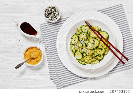 Sunomono, Japanese Cucumber Salad in a white bowl 107453503