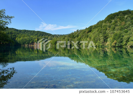 Water mirror of the Upper Lakes, Plitvice Lakes National Park, a world natural heritage site in Croatia Water mirror of the Upper Lakes, Plitvice Lakes National Park, a world natural heritage site in Croatia 107453645