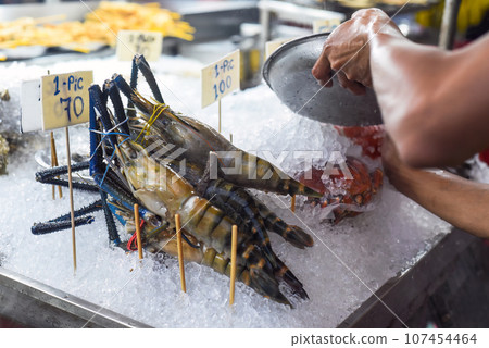 Raw shrimps in ice in the Jalan Alor street food in Kuala Lumpur Raw shrimps in ice in the Jalan Alor street food in Kuala Lumpur 107454464