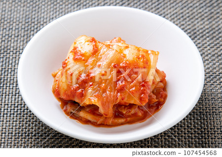 Chinese cabbage kimchi on a small plate. 107454568