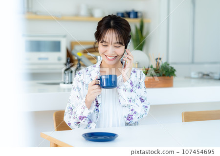 A young lady calling on a smartphone A young lady calling on a smartphone 107454695