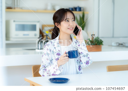 A young lady calling on a smartphone A young lady calling on a smartphone 107454697