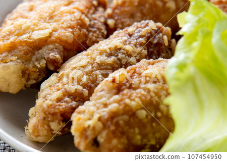 A close-up of fried chicken wings. A close-up of fried chicken wings. 107454950