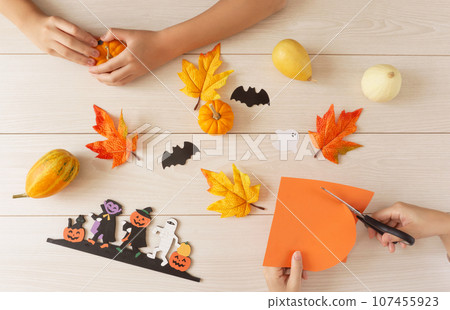 A family preparing for Halloween. 107455923