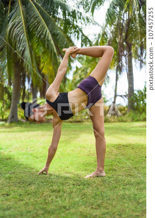 sugarcane pose or ardha chandra chapasana yoga with ukrainian woman making it outdoors sugarcane pose or ardha chandra chapasana yoga with ukrainian woman making it outdoors 107457255