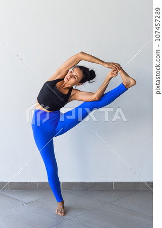 hand to big toe pose variation utthita hasta padangusthasana yoga with ukrainian woman making it indoors hand to big toe pose variation utthita hasta padangusthasana yoga with ukrainian woman making it indoors 107457289