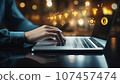 Close up of woman hands typing on laptop keyboard. Social media concept 107457474