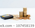 calculator and coins on white background, business and finance concept 107458139
