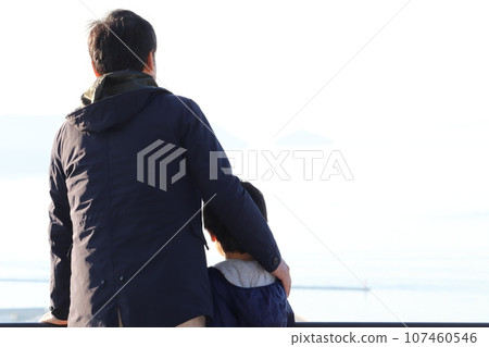 Cuddling father and son 107460546