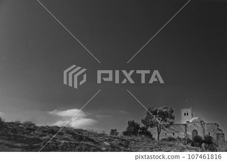 The historic Saint-Germain-l'Auxerrois Gothic style church in France, Black and white Paris cityscape with dramatic clouds 107461816