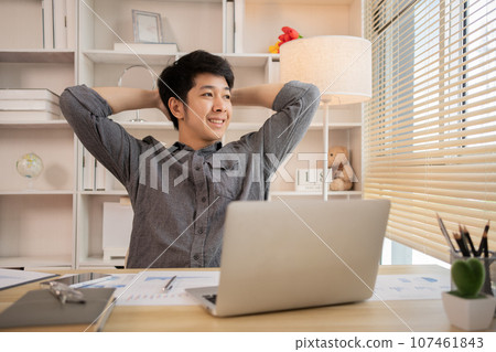 Young Man Relaxing After Work, Relaxed Young Man Unwinds, Stretch oneself. 107461843