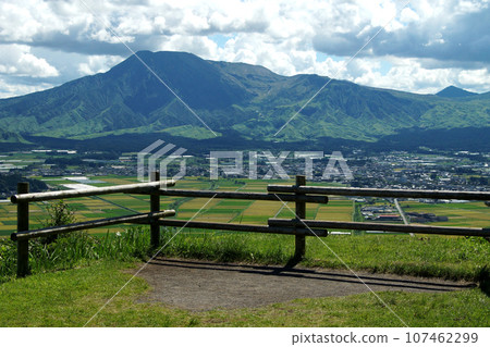 View from Aso City's "Shiroyama Observation Deck" - Aso Five Mountains and a patchwork-like rural landscape 107462299