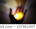 Hold the light that shines in the darkness in your hands 107462487