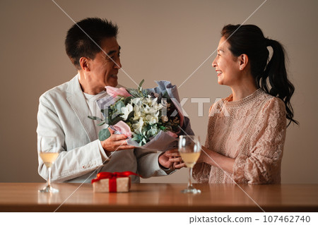 Senior couple celebrating anniversary 107462740