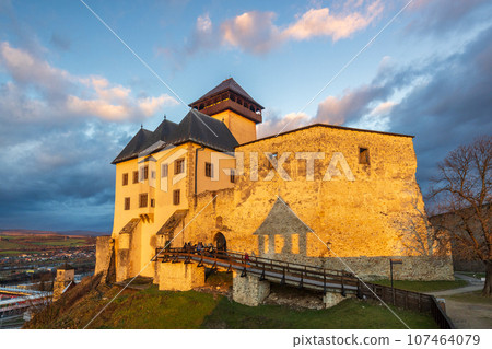 The Trencin Castle above the town of Trencin at sunset, Slovakia 107464079
