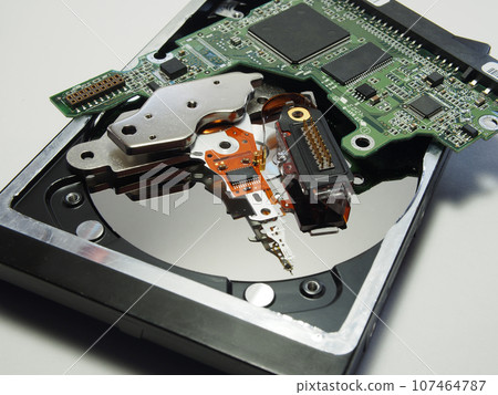 Hard drive, electronic circuit Board close-up. Components of electronic devices, macro photos. 107464787