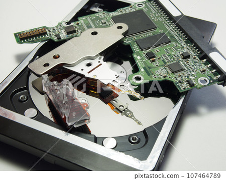 Hard drive, electronic circuit Board close-up. Components of electronic devices, macro photos. 107464789