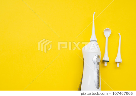 Mouth aerator on a yellow background with different nozzles. View from above Mouth aerator on a yellow background with different nozzles. View from above 107467066