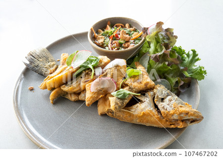 fried fish with vegetable and on table. top view shot 107467202