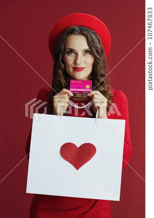 pensive woman in dress and beret isolated on background pensive woman in dress and beret isolated on background 107467833
